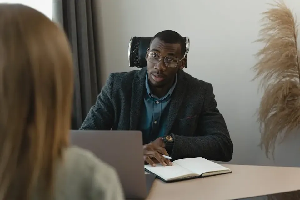 Man Talking to an Applying Woman 