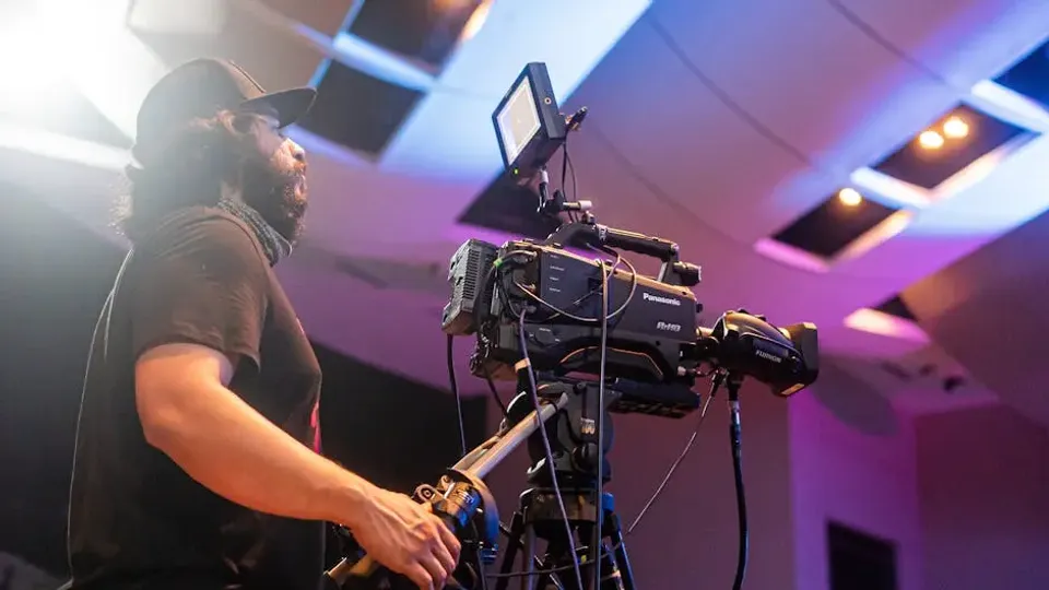 Professional camera man shooting concert